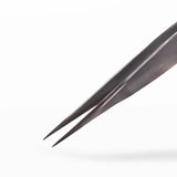 Close up of classic straight tweezers on a white background
