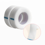 Roll of clear lash tape with close-up of adhesive surface on a white background