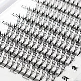 Close-up of false eyelashes with measurement scale on a white background