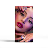 Advertisement for eyelash extensions with a close-up of a woman's face and false eyelashes.