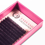 Pink box containing false eyelashes with 'Eyelash Excellence' branding.