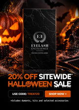 A promotional banner for Eyelash Excellence featuring a black marble-patterned box in the center, surrounded by Halloween-themed props including a carved pumpkin, candle, skull, and cobwebs. Large text at the bottom reads '20% OFF SITEWIDE HALLOWEEN SALE' with a discount code and shop button.