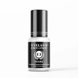 Eyelash extension glue bottle with black and white design on a white background